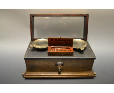 A pair Henry Troemner of Philadelphia travelling scientific scales, glazed case, with adjustable scale, boxed weights