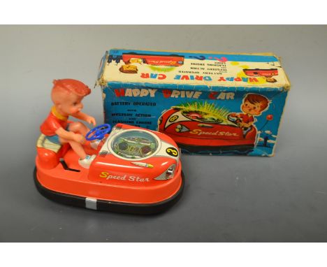 A Japanese tinplate battery operated Happy Drive Car, Mystery Action, Flashing Engine Lights, boxed