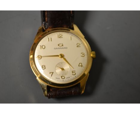 Garrard - a gentleman's 9ct gold wristwatch, Arabic numerals, champagne dial, baton indicator minute track, subsidiary second