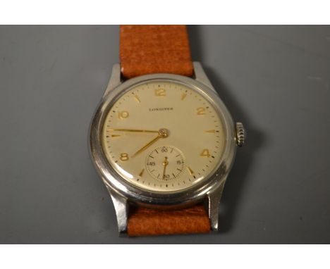 Longines - a stainless steel manual wrist watch. silvered dial, alternating gold coloured metal Arabic numerals and arrowhead