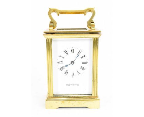 A Mappin &amp; Webb carriage clock, with brass and bevelled glass case, enclosing an enamel face with Roman numeral dial, wit