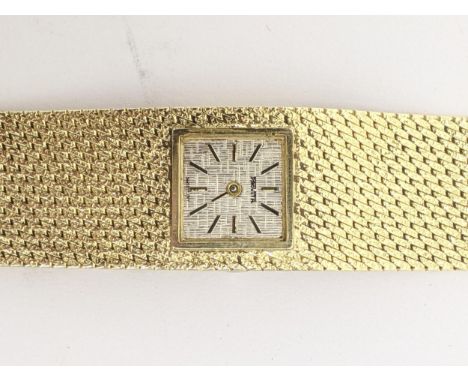 A Provita, manual wind, ladies, 14ct gold wristwatch, having a textured silvered dial with baton markers, on an integral mesh