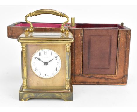 An early 20th century cased carriage clock, by Mortimer Ricks of Paignton, the brass case with bevelled glass, central circul