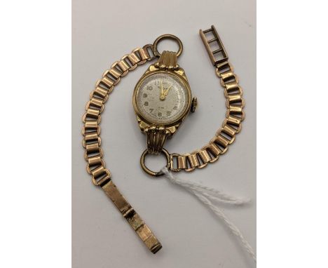 A Rotary, manual wind, ladies, 9ct gold cased wristwatch, circa 1954, having Arabic numerals, on a stamped 9ct gold bracelet,