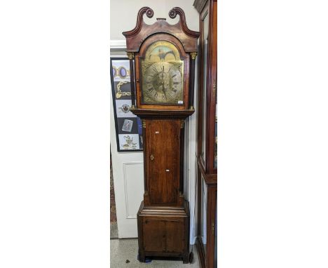 A George III oak and mahogany cased longcase clock, having a broken swan neck pediment, arched top dial signed F Webb London 