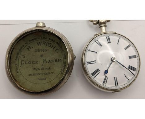 An early 19th century silver, pair cased pocket watch, having a white enamel dial with blued hands and Roman numerals, the mo