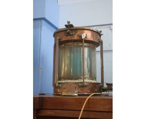 A brass and copper ships lamp