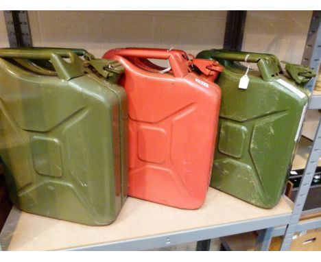 METAL JERRY CANS. Three vintage metal jerry cans