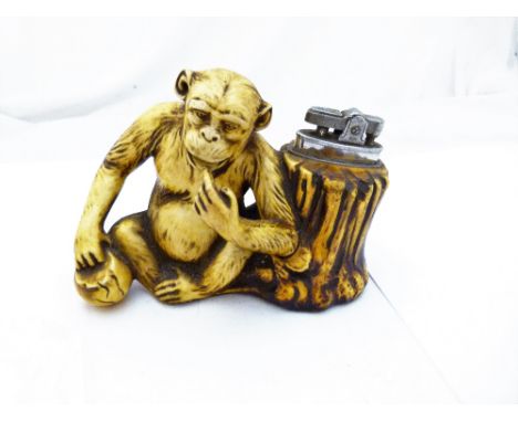 CHIMPANZEE TABLE LIGHTER. Ceramics Chimpanzee table lighter L: 10 cm