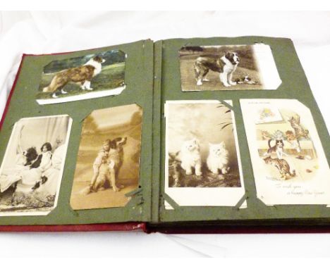 POSTCARD AND PHOTOGRAPH ALBUM. Album of vintage postcards and photographs, approximately 200