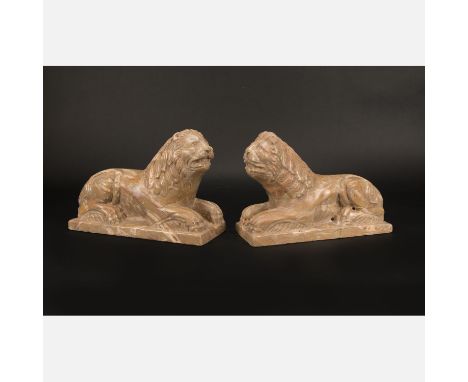 Pair of romanesque  Lions, In lying position on integrated base , light grey/greenish marble with white and brown veins , a p