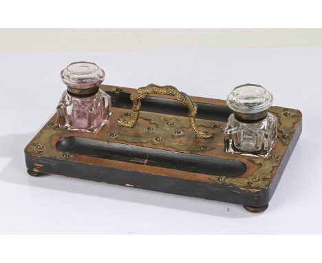 Victorian walnut desk stand, having twin glass inkwells either side of a gilt ormolu carrying handle in the form of a snake, 