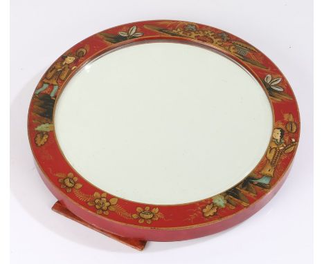 Chinese chinoiserie easel mirror, or circular form, decorated with figures and buildings on a red ground, 30cm diameter