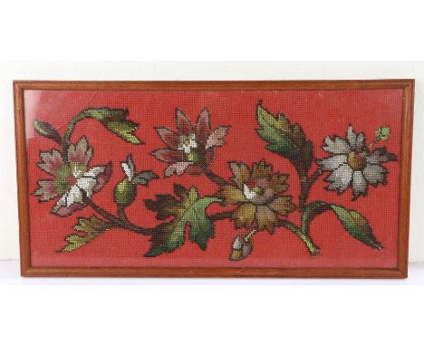 Beadwork panel depicting a blossoming branch on a red background, housed in a glazed oak frame, 25cm x 49cm