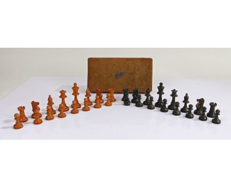 Ebony and boxwood chess set (unmarked, one associated plastic pawn), the tallest piece 7cm, housed within a leather Bridge bo