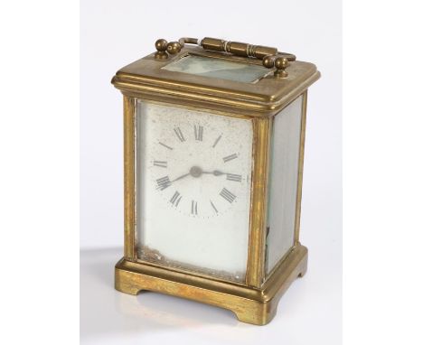 French brass cased carriage clock, the white enamel dial with Roman numerals, 14cm to top of handle