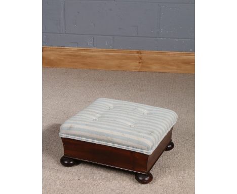 Victorian mahogany footstool, with striped button down upholstery and raised on four bun feet, 36cm wide x 35cm deep