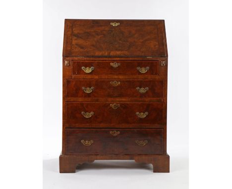 18th Century style walnut bureau, of narrow proportions, the sloping fall with feather crossbanded inlay, opening to reveal a