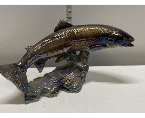 A large ceramic figure of a leaping salmon with lustre effect 