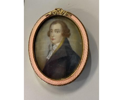 A early Victorian hand painted watercolour portrait on card in a gilt metal mount 