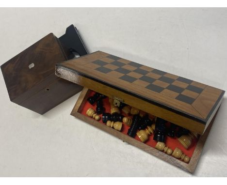 A wooden travelling chess set and a vintage tea caddy 