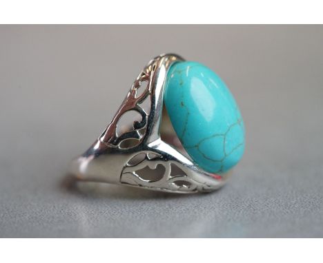 Silver ring with large turquoise cabochon stone 