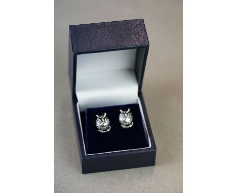 Pair of silver owl form stud earrings 