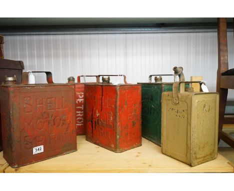 A collection of five vintage fuel cans to include Esso and Shell examples. 