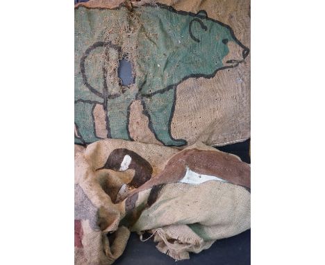 Three vintage hessian shooting practice targets with hand painted animal decoration. 