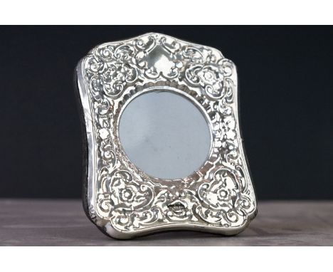 Silver easel back picture frame with embossed decoration 