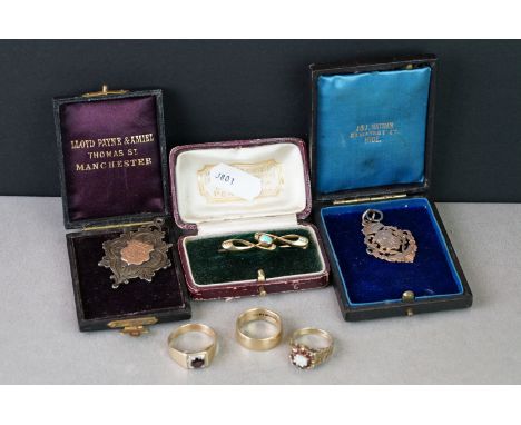 A collection of gold and silver jewellery to include three 9ct gold rings, a gold brooch, 9ct gold watch fob and a silver wat