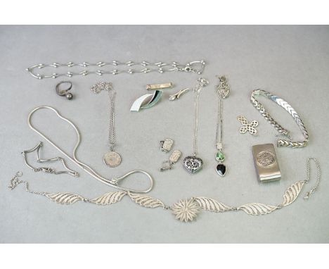 A collection of sterling silver jewellery to include necklaces, bracelets, brooches ..etc together with a money clip. 