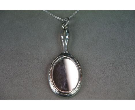 Silver pendant mirror with engraved decoration 