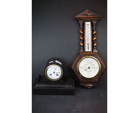 An antique slate mantle clock with chiming movement together with a wall hanging barometer. 