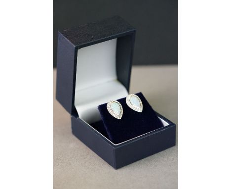 Pair of silver pear shaped CZ and opal panelled stud earrings 