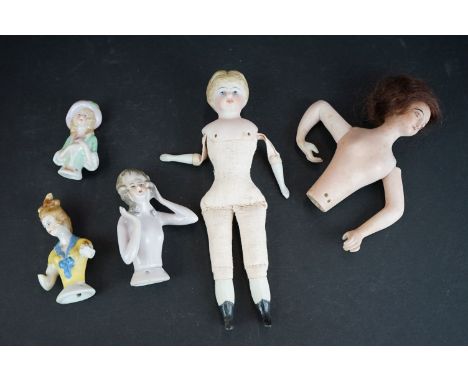 A collection of five antique ceramic pin dolls. 