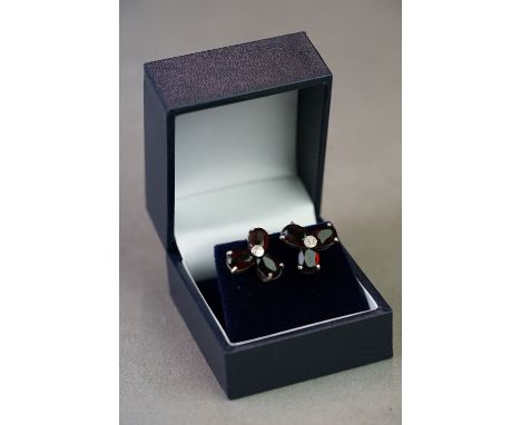 Pair of silver, garnet &amp; CZ flower form earrings 