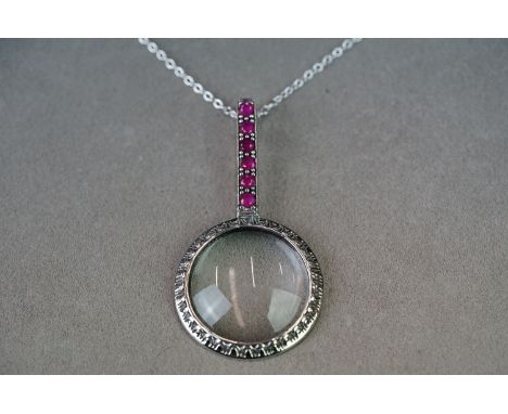 Silver pendant magnifying glass set with semi precious stones 