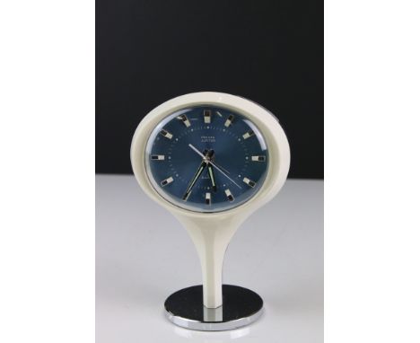 Mid century Presta Jupiter Mantle Clock with a blue face and raised on an atomic form base, 19cm high 