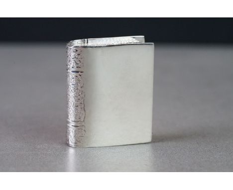 Silver pill box in the form of a book 