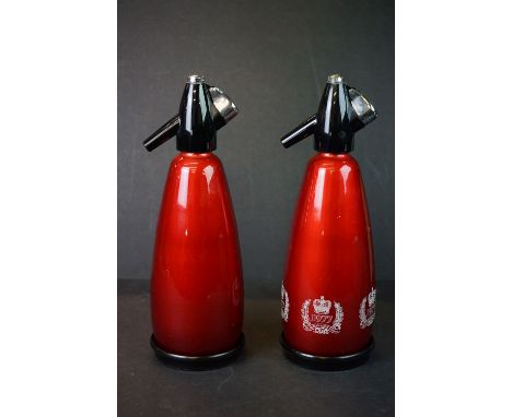 Two vintage red soda syphons to include a 1977 queens silver jubilee example. 