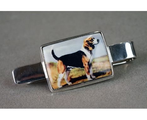 Silver and enamel money clip with pictorial image of a dog 