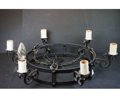 A wrought iron six branch chandelier. 