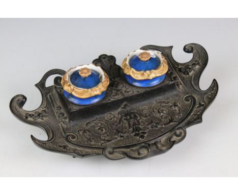 Victorian Coalbrookdale style Cast Iron Standish with two ceramic ink pots (both a/f), 26cm long 