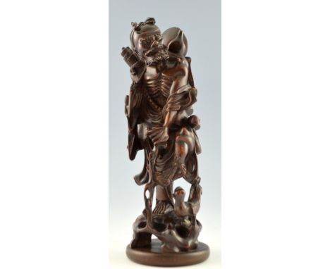 Chinese hardwood carving of a man with a chicken, 40cm high,PLEASE NOTE: THIS ITEM CONTAINS OR IS MADE OF IVORY. Buyers must 