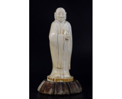 19th century Chinese carved ivory figure of sage in a long robe holding a bottle, 14.5cm high, on non-matching wooden stand,P