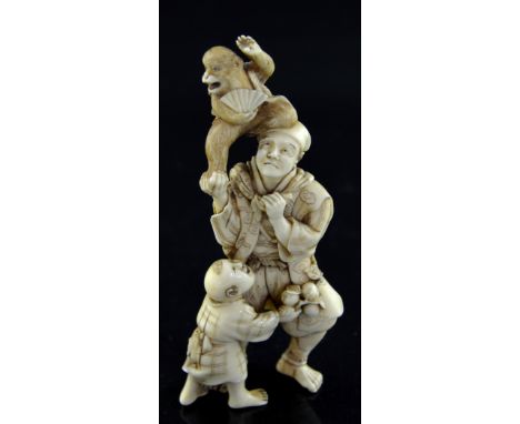 19th century Japanese okimono of a man with a boy and a monkey on his shoulders holding a fan, Meiji period, 14 cms highProve