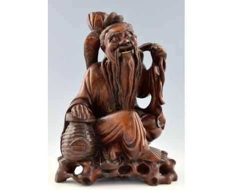 Chinese carved hardwood figure of a seated bearded man with a lobster pot, 35.5cm high,PLEASE NOTE: THIS ITEM CONTAINS OR IS 