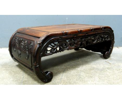 Chinese rosewood low table on scroll end supports, 31cm high,.   