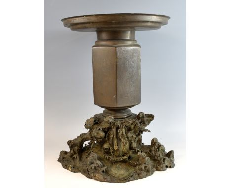 Chinese bronze vase of hexagonal section, the six faceted sides each decorated with a dragon with a flaming pearl, broad circ